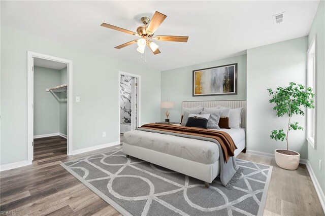2915 Berkley Ave, Chesapeake, VA 23325 - bedroom featuring wood finished floors, baseboards, a ceiling fan, and a spacious closet