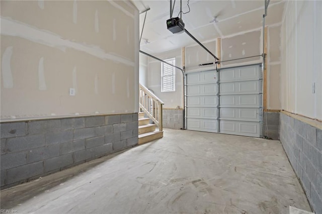 2915 Berkley Ave, Chesapeake, VA 23325 - garage featuring a garage door opener and concrete block wall