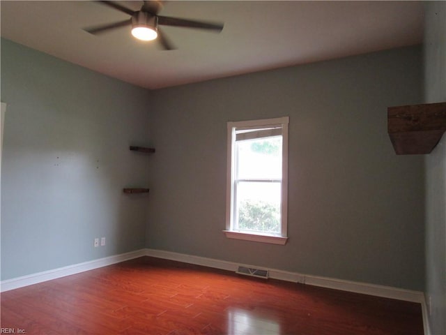 21139 Reynolds Dr, Carrollton, VA 23314 - unfurnished room with a ceiling fan, wood finished floors, and baseboards