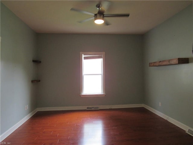 21139 Reynolds Dr, Carrollton, VA 23314 - spare room featuring ceiling fan, wood finished floors, and baseboards