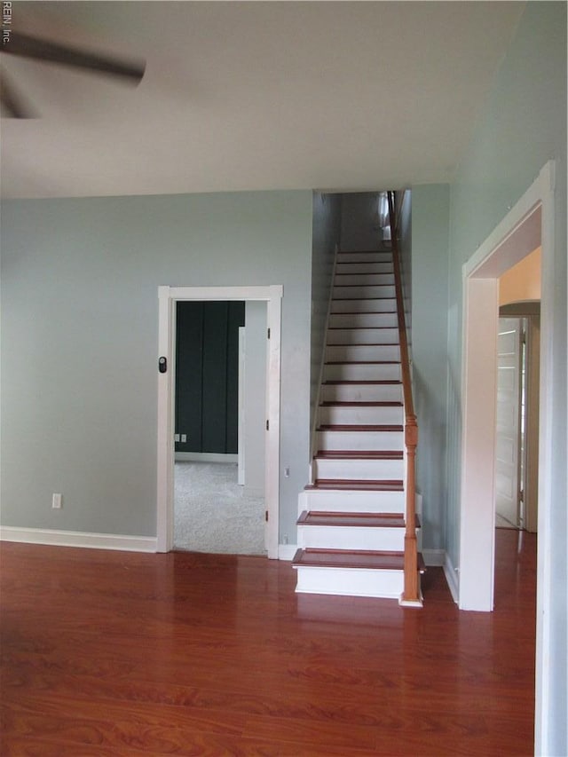 21139 Reynolds Dr, Carrollton, VA 23314 - stairs featuring baseboards and wood finished floors