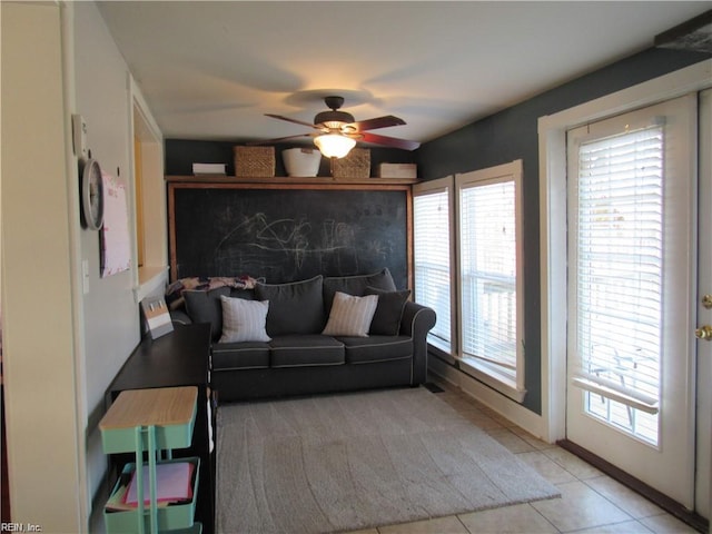 21139 Reynolds Dr, Carrollton, VA 23314 - living room featuring ceiling fan, light tile patterned floors, and baseboards