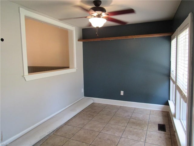 21139 Reynolds Dr, Carrollton, VA 23314 - tiled empty room featuring ceiling fan and baseboards