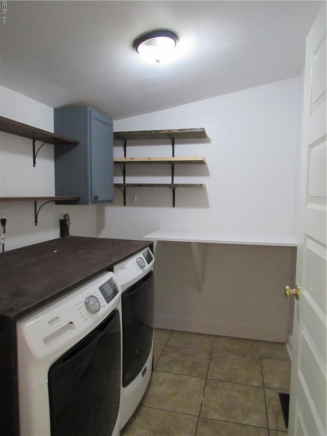 21139 Reynolds Dr, Carrollton, VA 23314 - laundry area featuring washing machine and clothes dryer, cabinet space, and light tile patterned flooring