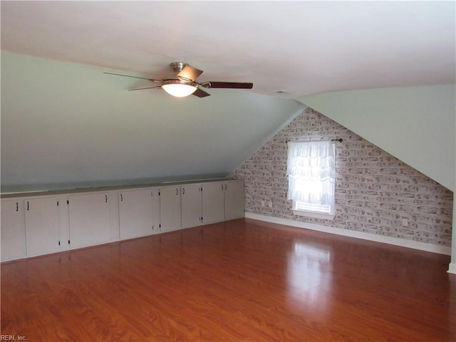 21139 Reynolds Dr, Carrollton, VA 23314 - additional living space with baseboards, wood finished floors, ceiling fan, and vaulted ceiling