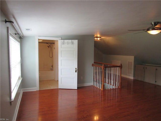 21139 Reynolds Dr, Carrollton, VA 23314 - empty room featuring a ceiling fan, wood finished floors, and baseboards