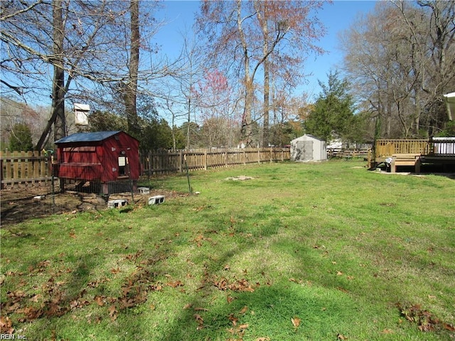 21139 Reynolds Dr, Carrollton, VA 23314 - view of yard with a wooden deck and exterior structure