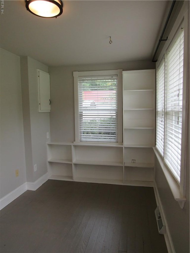 21139 Reynolds Dr, Carrollton, VA 23314 - unfurnished room with dark wood-style flooring and baseboards
