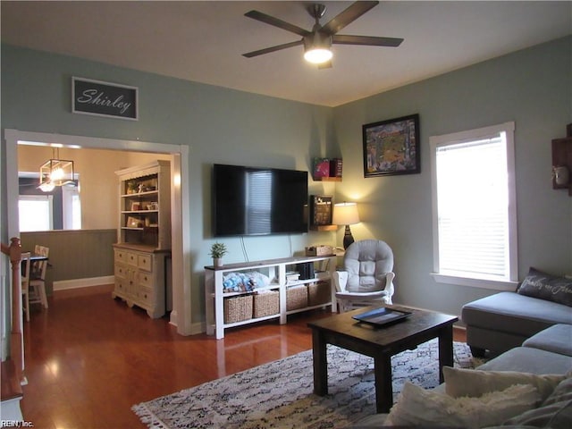 21139 Reynolds Dr, Carrollton, VA 23314 - living area featuring ceiling fan, wood finished floors, and baseboards