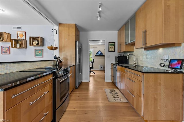 5409 Challedon Dr, Virginia Beach, VA 23462 - kitchen with appliances with stainless steel finishes, a sink, backsplash, light wood-style floors, and modern cabinets