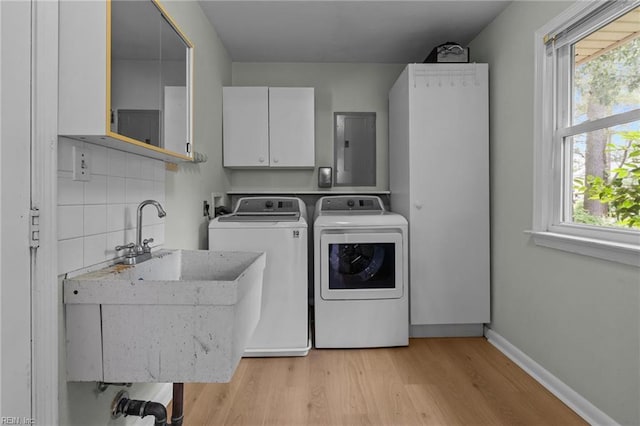 5409 Challedon Dr, Virginia Beach, VA 23462 - laundry area featuring cabinet space, electric panel, washer and clothes dryer, light wood-type flooring, and plenty of natural light