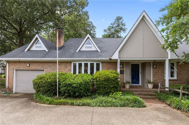 5409 Challedon Dr, Virginia Beach, VA 23462 - view of front of property with a garage, a shingled roof, a chimney, and brick siding