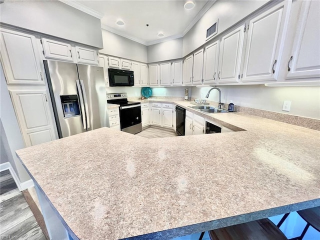 30 Brough Ln # 301, Hampton, VA 23669 - kitchen featuring black appliances, a sink, ornamental molding, light countertops, and a peninsula