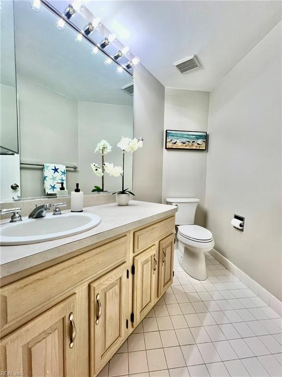 30 Brough Ln # 301, Hampton, VA 23669 - bathroom featuring tile patterned flooring, vanity, toilet, and baseboards