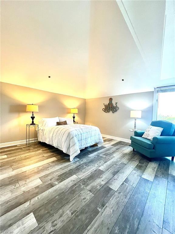 30 Brough Ln # 301, Hampton, VA 23669 - bedroom featuring wood-type flooring, vaulted ceiling, and baseboards