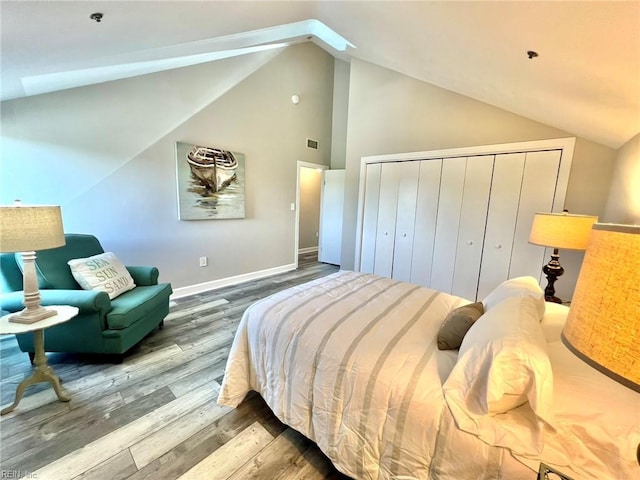 30 Brough Ln # 301, Hampton, VA 23669 - bedroom with vaulted ceiling, wood finished floors, a closet, and baseboards