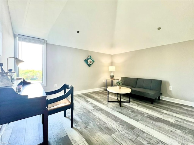30 Brough Ln # 301, Hampton, VA 23669 - living area featuring wood finished floors, baseboards, and lofted ceiling