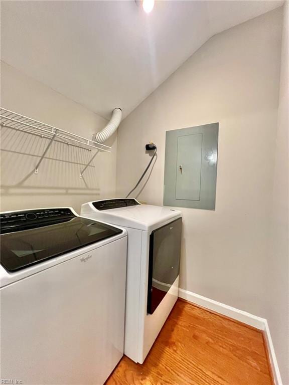 30 Brough Ln # 301, Hampton, VA 23669 - laundry room featuring electric panel, washing machine and dryer, light wood finished floors, and baseboards