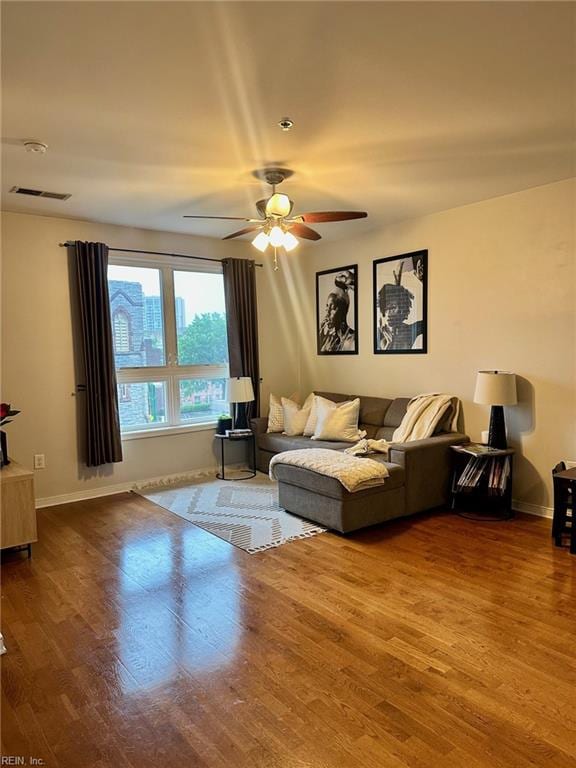 388 Boush St Unit 307, Norfolk, VA 23510 - living area featuring wood finished floors, ceiling fan, and baseboards