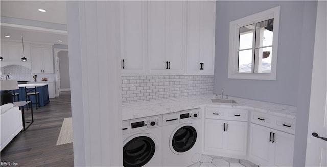 814 Calthrop Neck Rd, Yorktown, VA 23693 - washroom with washing machine and dryer, dark wood-style flooring, cabinet space, and recessed lighting