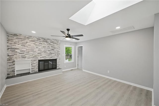 808 Williams Ave, Chesapeake, VA 23323 - unfurnished living room with wood finished floors, ceiling fan, baseboards, recessed lighting, and a skylight