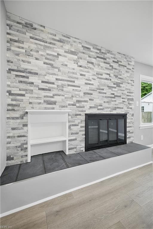 808 Williams Ave, Chesapeake, VA 23323 - detailed view of a tiled fireplace, wood finished floors, and baseboards