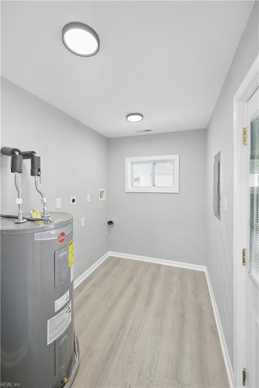 808 Williams Ave, Chesapeake, VA 23323 - laundry area with electric water heater, hookup for an electric dryer, light wood finished floors, baseboards, and hookup for a washing machine