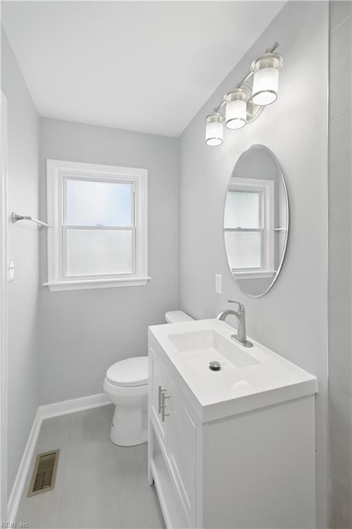 808 Williams Ave, Chesapeake, VA 23323 - bathroom with vanity, toilet, and baseboards