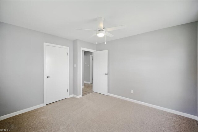 808 Williams Ave, Chesapeake, VA 23323 - unfurnished bedroom with carpet floors, baseboards, a closet, and a ceiling fan