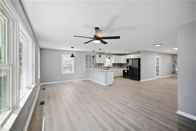 808 Williams Ave, Chesapeake, VA 23323 - unfurnished living room with ceiling fan, light wood-type flooring, baseboards, recessed lighting, and a sink