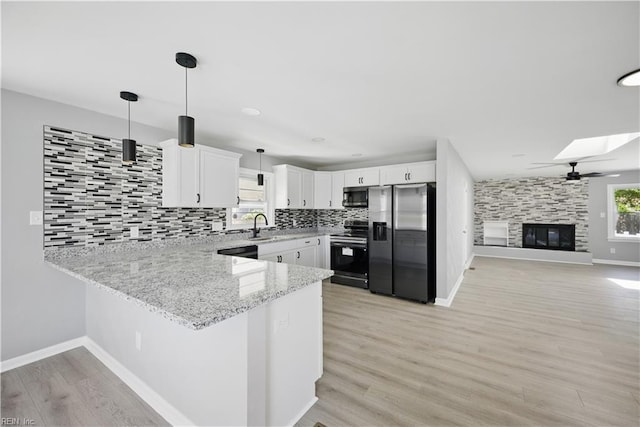 808 Williams Ave, Chesapeake, VA 23323 - kitchen featuring range with electric cooktop, fridge with ice dispenser, stainless steel microwave, a peninsula, and tasteful backsplash