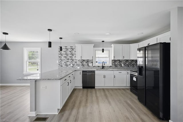 808 Williams Ave, Chesapeake, VA 23323 - kitchen featuring dishwasher, refrigerator with ice dispenser, stove, a sink, and a peninsula