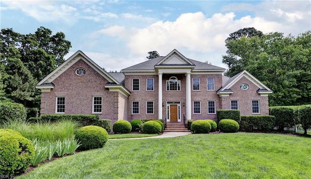 2081 Harpers Ml, Williamsburg, VA 23185 - greek revival inspired property featuring a front lawn and brick siding