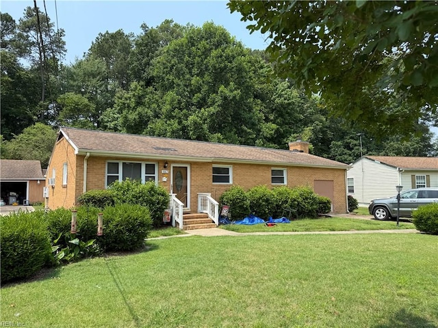 107 Carver Pl, Yorktown, VA 23692 - ranch-style house featuring a front yard, brick siding, and a chimney