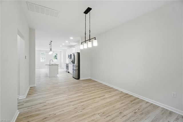 1245 Maltby Ave, Norfolk, VA 23504 - unfurnished dining area with a sink, light wood finished floors, baseboards, and recessed lighting