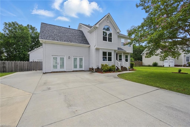 433 Cedar Pointe Ln, Chesapeake, VA 23323 - view of front facade featuring french doors, a shingled roof, and driveway