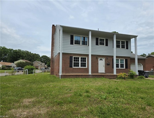 305 Rudisill Rd, Hampton, VA 23669 - view of front of house featuring brick siding, a chimney, and a garage