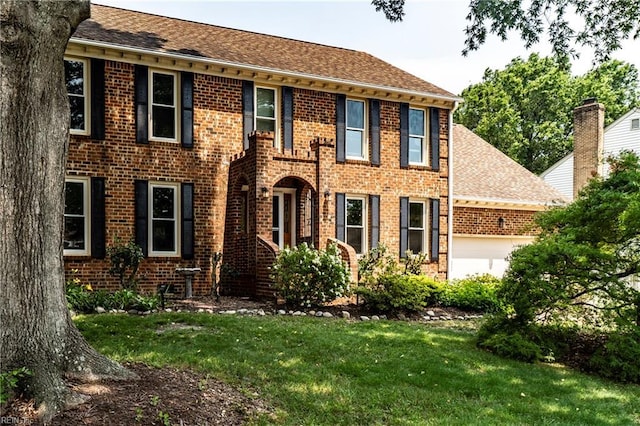840 Five Forks Rd, Virginia Beach, VA 23455 - colonial-style house featuring brick siding, an attached garage, a front lawn, and roof with shingles