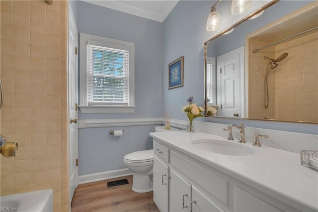 136 Wynnwood Dr, Franklin, VA 23851 - bathroom with ornamental molding, vanity, toilet, tub / shower combination, and wood finished floors