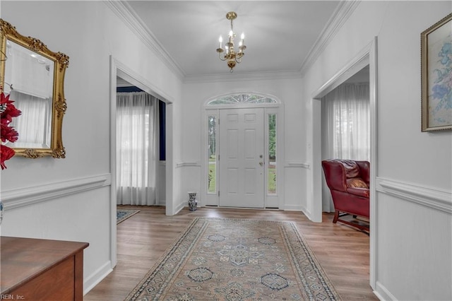 136 Wynnwood Dr, Franklin, VA 23851 - foyer entrance featuring a chandelier, wood finished floors, and ornamental molding