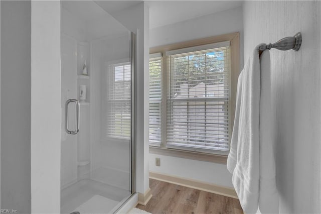 136 Wynnwood Dr, Franklin, VA 23851 - full bathroom featuring a stall shower, baseboards, and wood finished floors