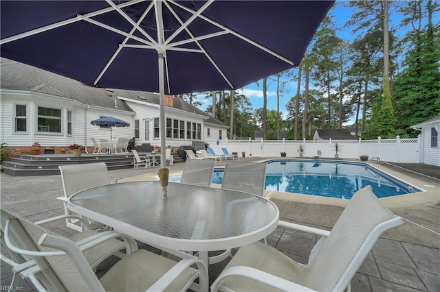 136 Wynnwood Dr, Franklin, VA 23851 - view of swimming pool with outdoor dining space, a patio, a fenced backyard, and entry steps