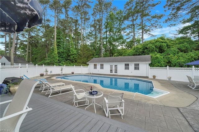 136 Wynnwood Dr, Franklin, VA 23851 - view of pool featuring a fenced backyard, a storage structure, a patio area, an outdoor structure, and view of wooded area
