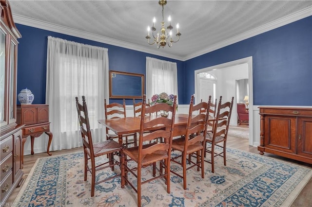 136 Wynnwood Dr, Franklin, VA 23851 - dining room featuring a chandelier, ornamental molding, and light wood finished floors