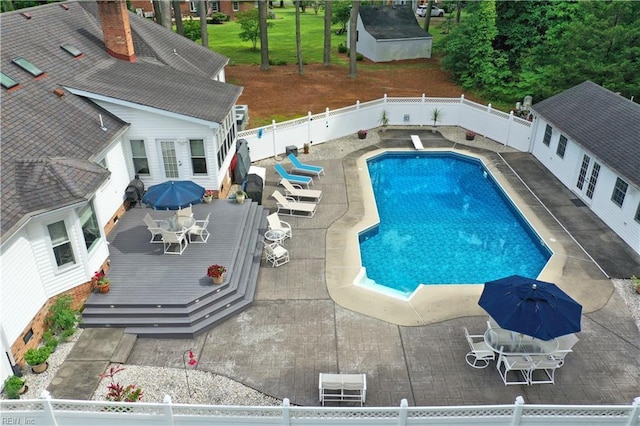 136 Wynnwood Dr, Franklin, VA 23851 - view of swimming pool featuring a fenced backyard, a deck, outdoor dining space, and a patio area