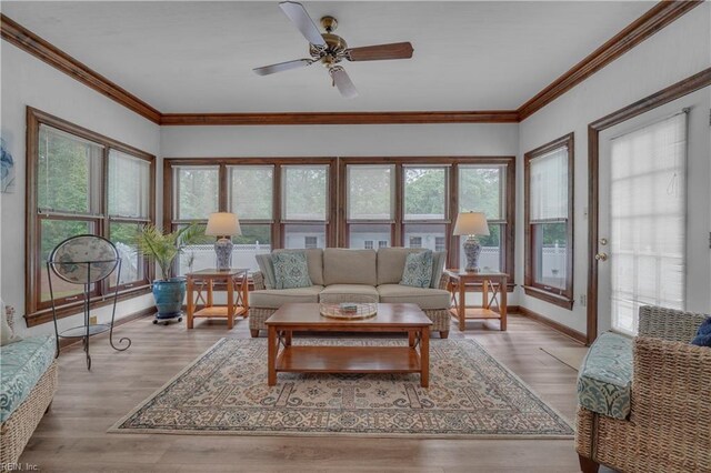 136 Wynnwood Dr, Franklin, VA 23851 - living room featuring a ceiling fan, baseboards, wood finished floors, and crown molding
