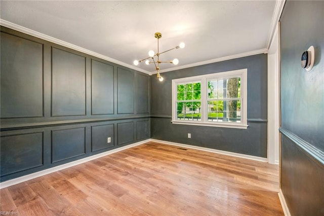 23 Signi Hi Ct, Newport News, VA 23601 - empty room featuring crown molding, a chandelier, light wood-style floors, a decorative wall, and baseboards