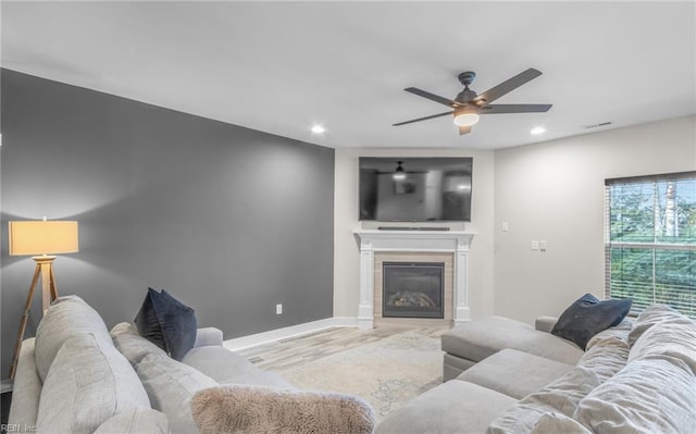 126 Secretariat Dr, Suffolk, VA 23435 - living room with ceiling fan, recessed lighting, wood finished floors, a glass covered fireplace, and baseboards