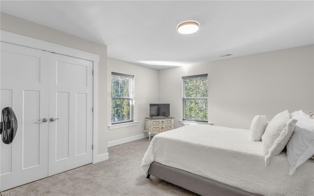 126 Secretariat Dr, Suffolk, VA 23435 - carpeted bedroom featuring multiple windows and baseboards