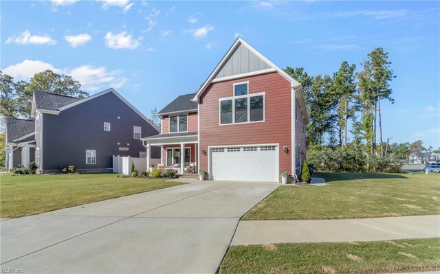 126 Secretariat Dr, Suffolk, VA 23435 - view of front of property with an attached garage, a front yard, board and batten siding, and driveway